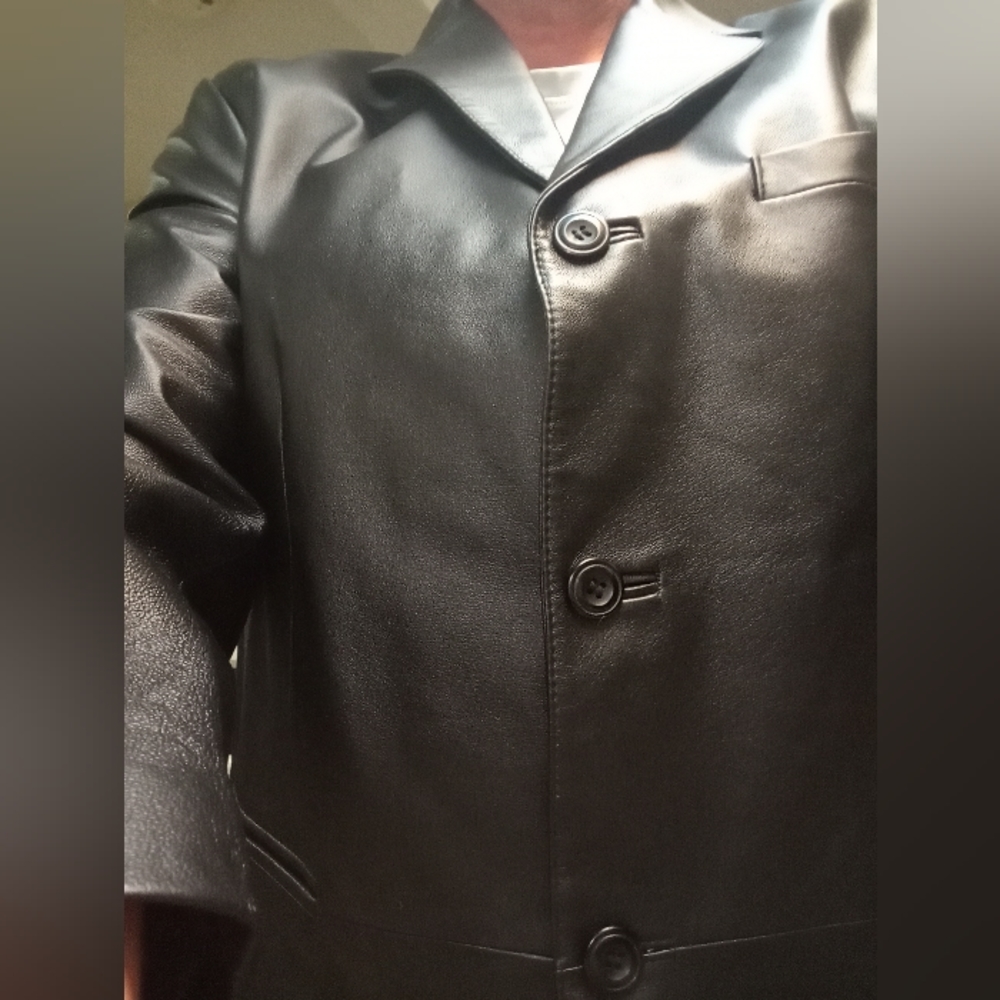 Leather coat. 3 button. Like new and not even broken in yet. Long, dress style.